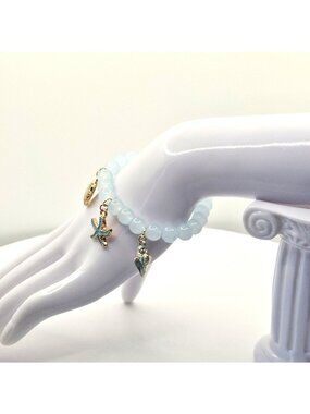 Ocean-Inspired Stretch Bead Bracelet With Starfish Shell And Conch Charms